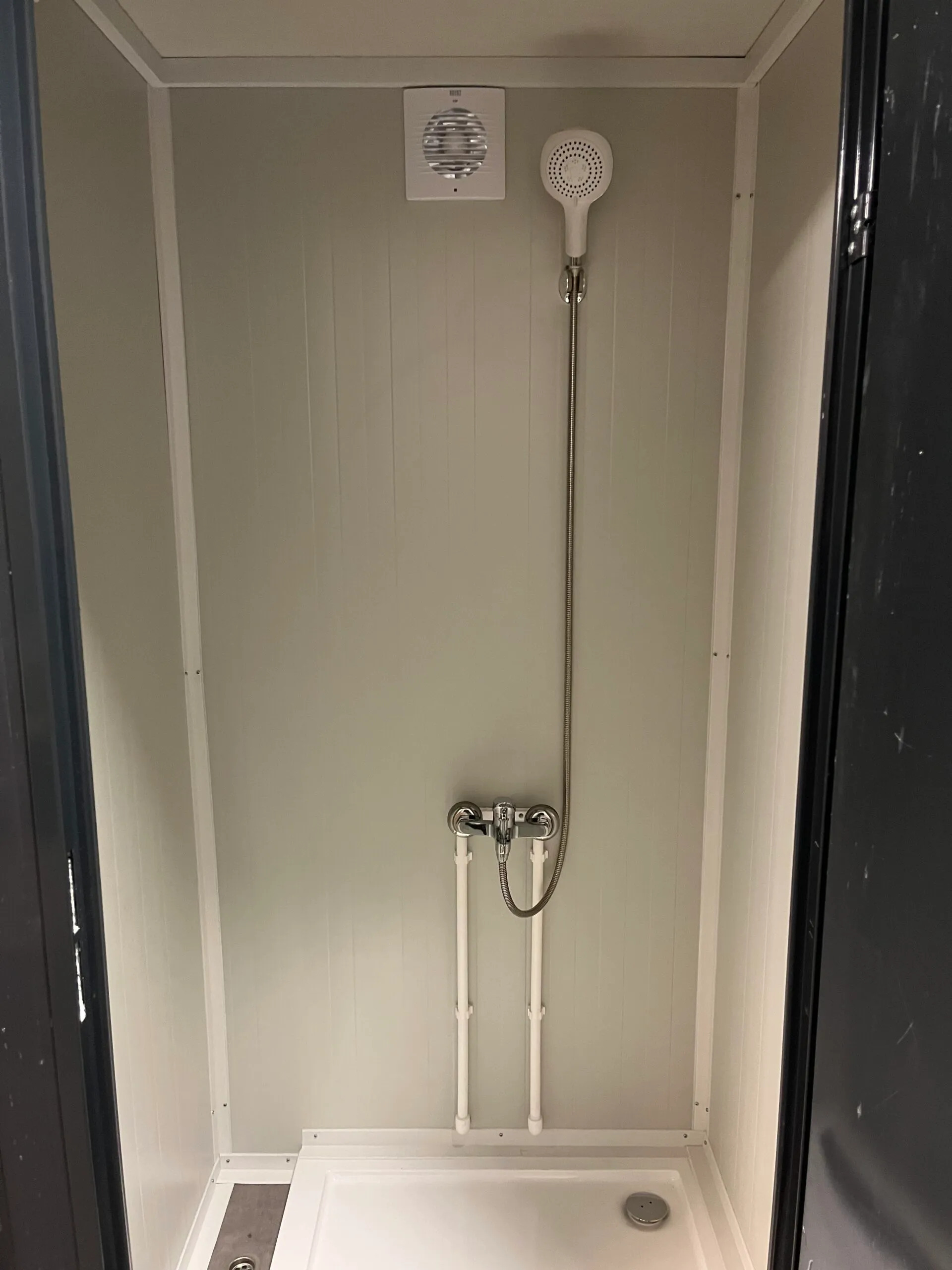 Interior of a luxury portable shower unit for camping.