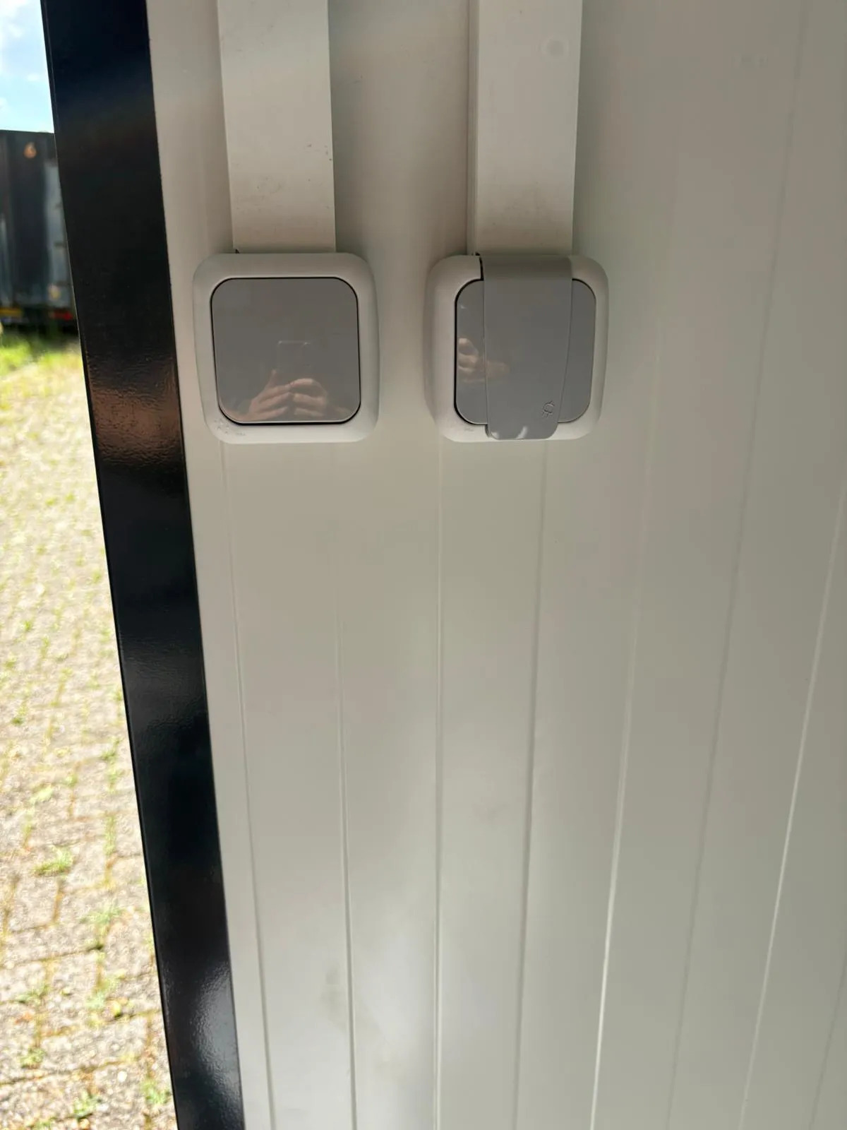 Light switches inside a portable bathroom unit.