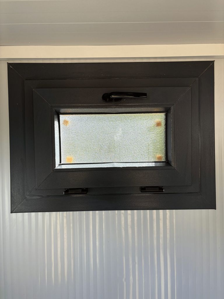 Window of a portable shower unit for camping in closed position.