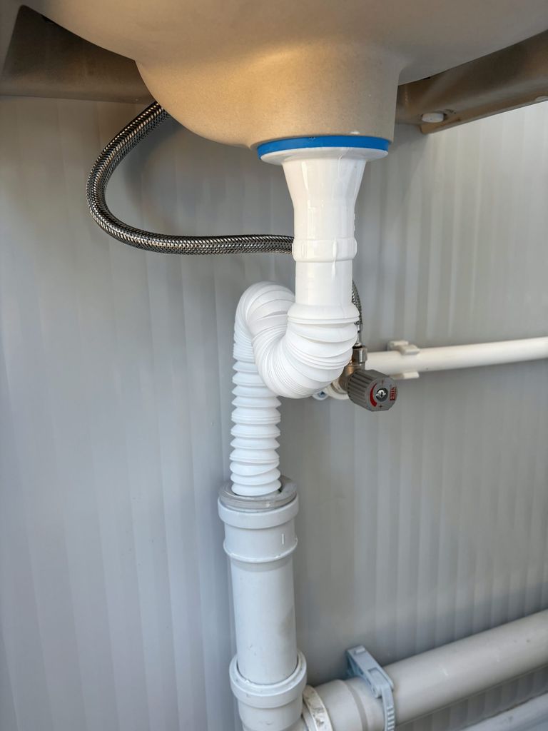 Drainage piping of a portable toilet unit for camping.
